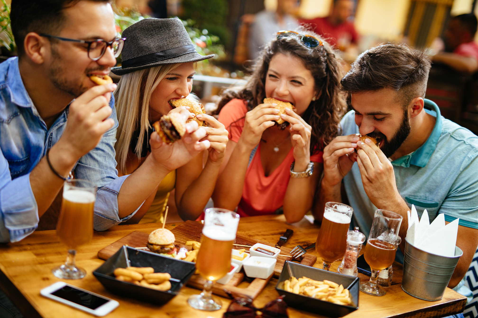 Friends eating fast food in a restaurant